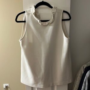 White blouse. V-Neck in the back